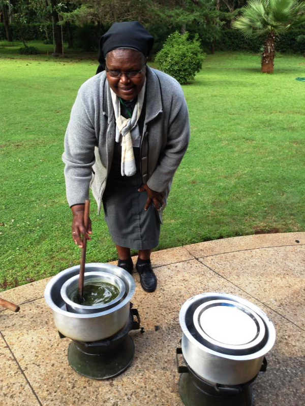 Photo of Sr Francisca stirs an ointment in water bath during seminar May 2018