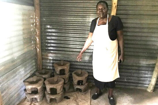 Domtilla outside the new stoves workshop where she will be training women to make the stove liners